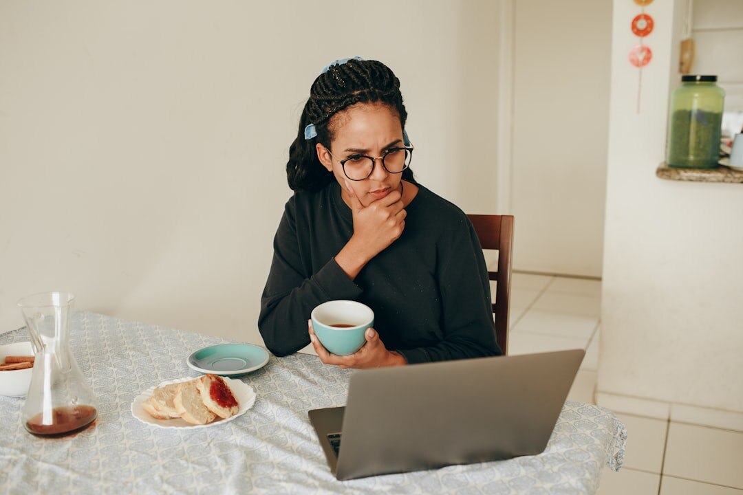 Senior woman video calling her family on a laptop at home