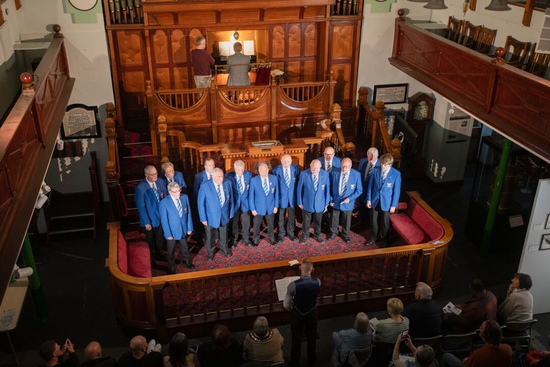 Senior choir singing together on a small stage