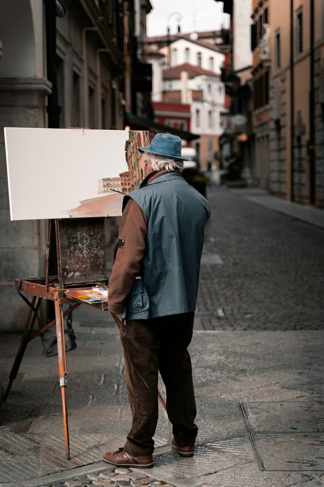 Seniors painting together at an art workshop table