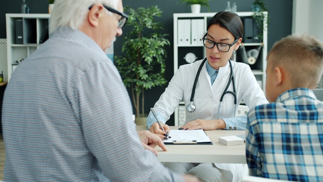 doctor checking elderly patient